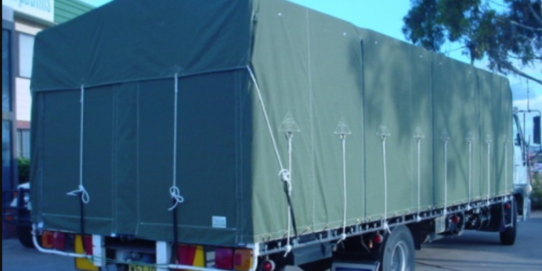 A truck tarp attached to a truck