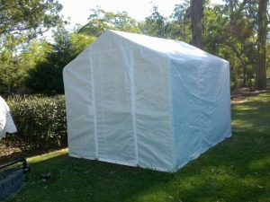 backyard greenhouse with white shade cover